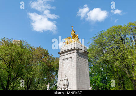 The historic golden Maine monument statue located in Colombus Circle at the south entrance of Central Park in New York City Manhattan. Stock Photo