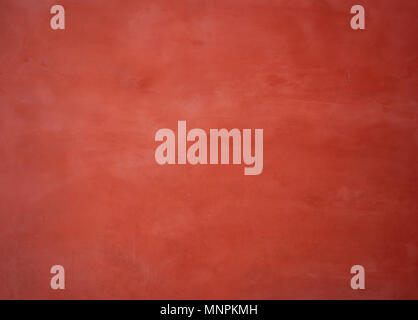 Red painted wall background with washed-out color Stock Photo