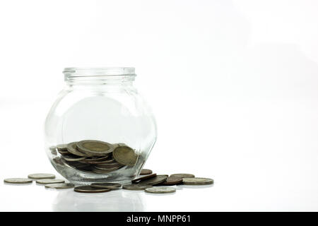 Save money and investment concept, coins growing up in glass isolated on white background Stock Photo