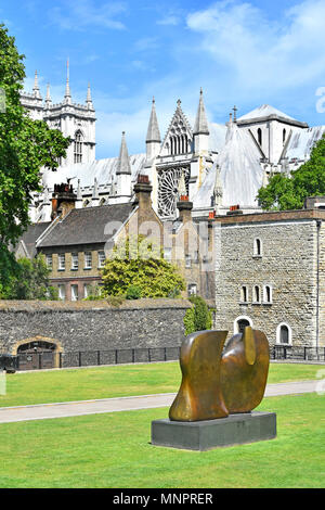 Sculptor Henry Moore bronze abstract modern art sculpture Knife Edge Two Piece in College Green Park Jewel Tower & Westminster Abbey beyond London UK Stock Photo