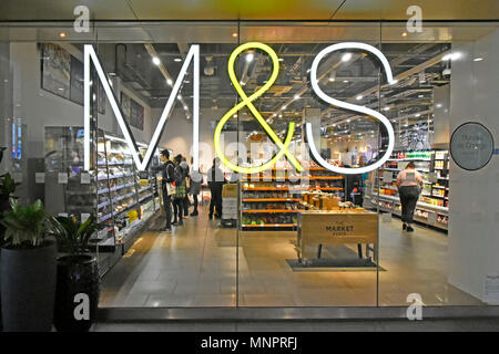 M & S M&S foodhall illuminated sign shop window & interior of Marks and Spencer food hall Westfield Shopping Centre Stratford East London England UK Stock Photo