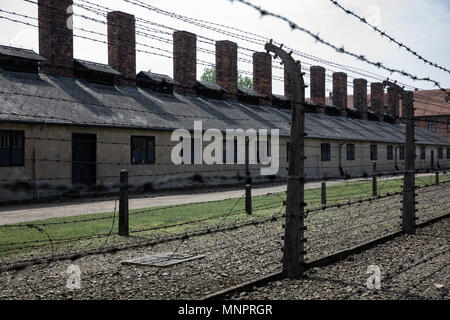 Electric barbed wire fence in Nazi Concentration Camp Auschwitz Stock Photo