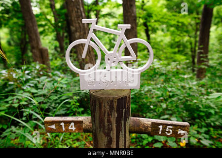 Sign for cyclists, mountain bikers on the way, Hakuba, Japanese Alps, Japan Stock Photo