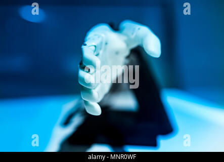 plastic robot hand with open palm gesture Stock Photo