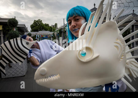 Artists in unusual costumes dance on Revolution Square in the center of Moscow during the festival Fish Week, Russia Stock Photo