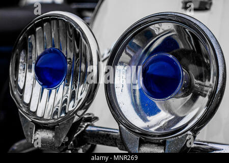 Close up of two headlights on a scooter with blue centres Stock Photo