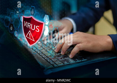 Press enter button on the keyboard computer Protective shield virus red Exclamation Warning Caution Computer in dark with word virus Stock Photo