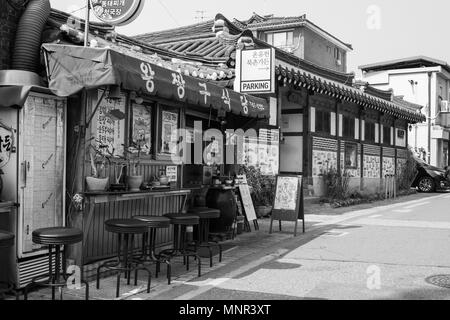 Monochrome image of food stall with Korean shop sign on a quiet street in Seoul, Korea Stock Photo