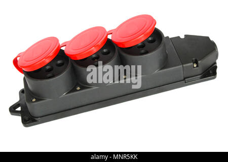 Electrical three-phase sockets in a plastic casing and red caps to protect from moisture Stock Photo