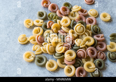 Ufo Shaped Colorful Junior Raw Pasta / Colored or Tri Color. Raw Food. Stock Photo