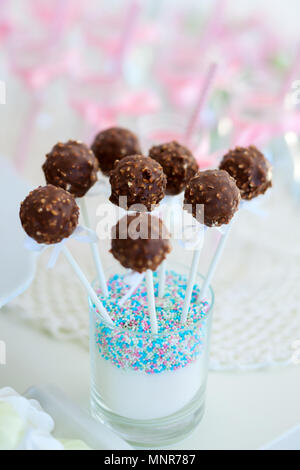 Chocolate cake pops on a dessert table at party or wedding celebration Stock Photo