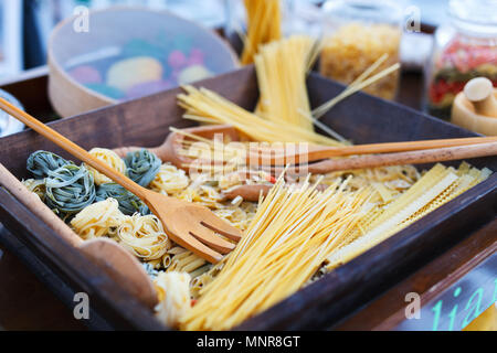 Variety of types and shapes of uncooked Italian pasta Stock Photo
