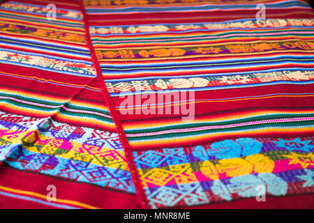 Peruvian traditional woven wool fabric background, colorful Stock Photo