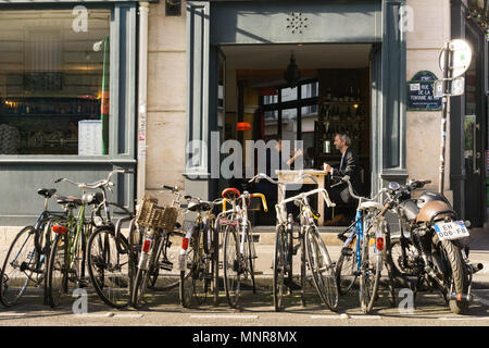 Private bicycles parked on street in Paris, France. Stock Photo