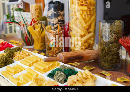 Variety of types and shapes of uncooked Italian pasta Stock Photo