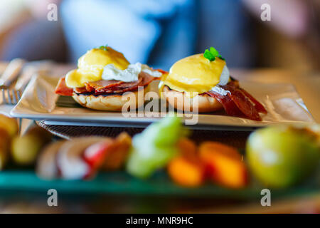 Delicious breakfast with poached eggs Benedict Stock Photo