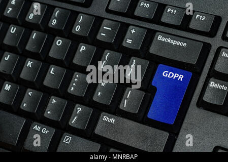 blue keyboard key with text GDPR as symbol for Privacy and General Data Protection Regulation on a notebook computer Stock Photo