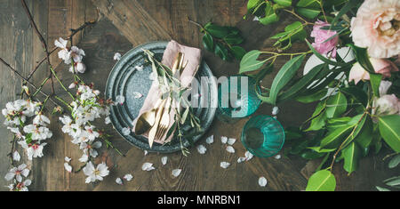 Flat-lay of Table setting with spring flowers Stock Photo
