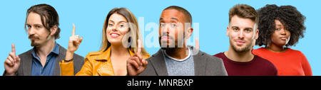 Group of mixed people, women and men raising finger, the number one Stock Photo