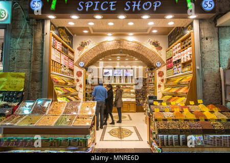 Customers peruse the shelves of a spice shop at Istanbul Spice bazaar in Turkey Stock Photo