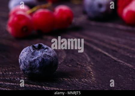 Berry blueberry close-up on a wooden table Stock Photo
