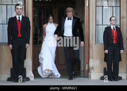 The newly married Duke and Duchess of Sussex, Meghan Markle and Prince Harry, leaving Windsor Castle after their wedding to attend an evening reception at Frogmore House, hosted by the Prince of Wales. Stock Photo