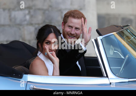 The newly married Duke and Duchess of Sussex, Meghan Markle and Prince Harry, leaving Windsor Castle after their wedding to attend an evening reception at Frogmore House, hosted by the Prince of Wales. Stock Photo