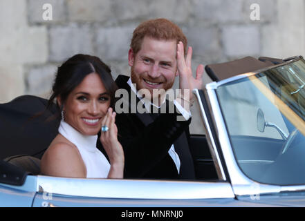 The newly married Duke and Duchess of Sussex, Meghan Markle and Prince Harry, leaving Windsor Castle after their wedding to attend an evening reception at Frogmore House, hosted by the Prince of Wales. Stock Photo