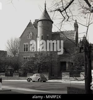 1950s, historical, exterior view of The Tower House, an architecturally important late-victorian house in Kensington, near Holland Park. London, England, UK. Built around 1878 in the Gothic revival style by the designer William Burges as his own home, it is currently owned by the Led Zeppelin guitarist and rock star, Jimmy Page who brought it in 1972. The house in Melbury Road has a fascinating history and was previously owned by the Irish actor Richard Harris, whom Page purchased it from, supposedly outbidding the pop legend David Bowie. Stock Photo