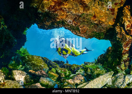 woman scuba diver, exploring a small freshwater spring in the Rainbow River, Dunnellon, Florida, USA, MR Stock Photo
