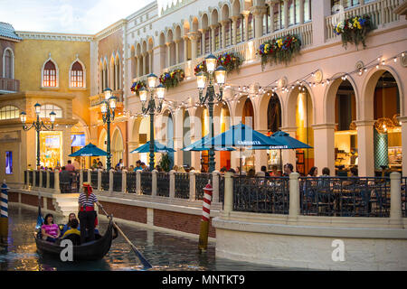 LAS VEGAS, NEVADA - MAY 15, 2018: View along the Grand Canal at the beautiful Venetian resort hotel casino in Las Vegas Nevada restaurants and people. Stock Photo