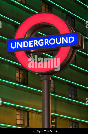 London Underground Sign illuminated at night, London, England, UK Stock Photo
