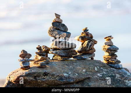 Stack of balanced stones on seashore Stock Photo