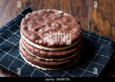 Stack Of Dark Chocolate Covered Rice Cakes or Corn Crackers. Appetizer Concept. Stock Photo