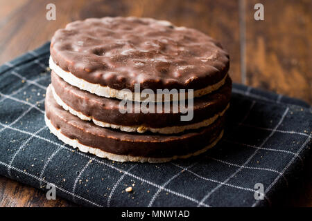 Stack Of Dark Chocolate Covered Rice Cakes or Corn Crackers. Appetizer Concept. Stock Photo