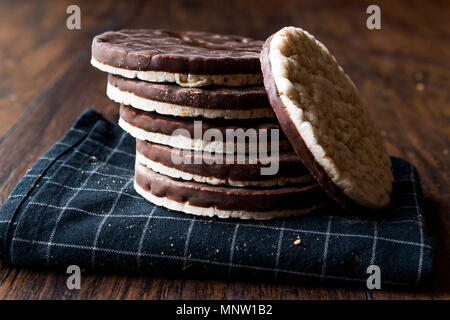 Stack Of Dark Chocolate Covered Rice Cakes or Corn Crackers. Appetizer Concept. Stock Photo