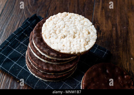 Stack Of Dark Chocolate Covered Rice Cakes or Corn Crackers. Appetizer Concept. Stock Photo