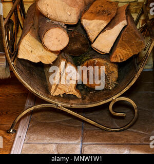 Stack Of Dry Firewood And Fireplace Accessories Stand Near House