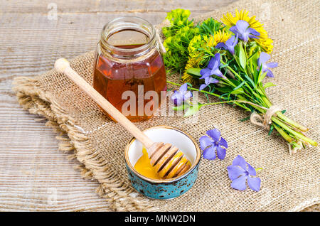 Fresh fragrant tasty honey from wild plants. Studio Photo Stock Photo