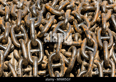Big pile of a massive metal chain used in shipbuilding Stock Photo