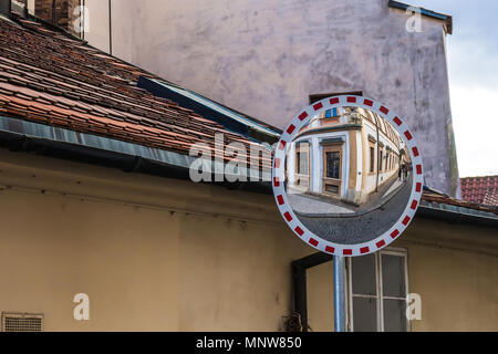 Traffic mirror reflecting a historical house at Hradcany, Prague, Czech republic. Stock Photo