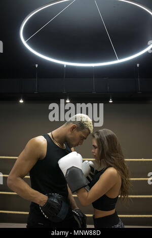 Beautiful sports couple in a boxing ring. Stock Photo