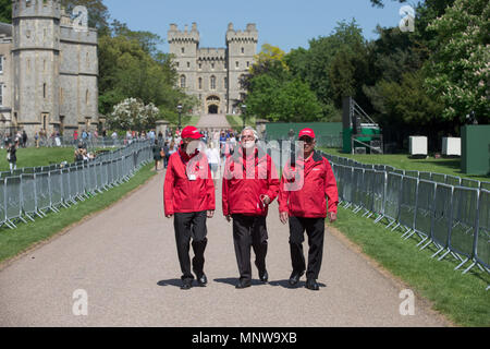 Picture dated May 19th volunteers at the wedding of  Prince Harry and Meghan Markle in Windsor helping the crowds.   Prince Harry and Meghan Markle have been declared husband and wife, following a ceremony at Windsor Castle. The couple exchanged vows and rings before the Queen and 600 guests at St George's Chapel. Wearing a dress by British designer Clare Waight Keller, Ms Markle was met by Prince Charles, who walked her down the aisle. Following their marriage, the couple will be known as the Duke and Duchess of Sussex. Stock Photo