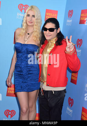 Courtney Anne Mitchell and her husband Corey Feldman attend the