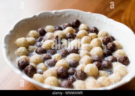 Chocolate Corn balls with milk. Breakfast Concept. Stock Photo