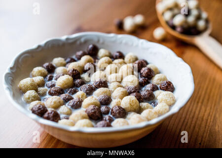 Chocolate Corn balls with milk. Breakfast Concept. Stock Photo