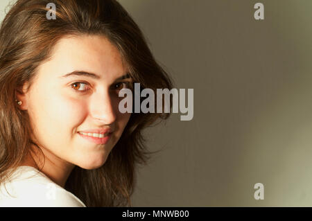 Young woman smiling and looking at the camera. Stock Photo
