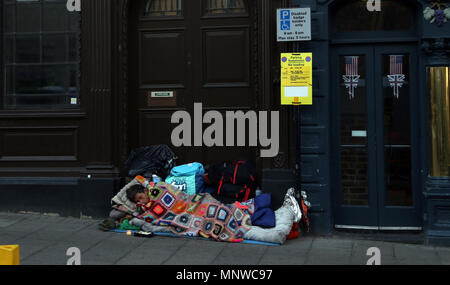 Windsor, UK, 19 May 2018. A person sleeps in a doorway in Windsor on the day of the Royal Wedding. Royal Wedding of HRH Prince Harry (of Wales) and Meghan Markle, Windsor, Berkshire, on May 19, 2018. Credit: Paul Marriott/Alamy Live News Stock Photo