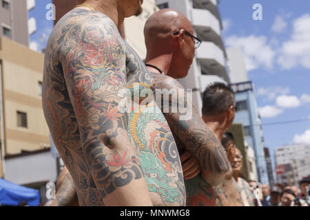 Tokyo, Japan. 20th May 2018. Participants showing their full body tattooed, possibly members of the Japanese mafia or Yakuza, attend the Sanja Matsuri in Asakusa district. The Sanja Matsuri is one of the largest Shinto festivals in Tokyo, and it is held in Tokyo's Asakusa district for three days around the third weekend of May. Credit: ZUMA Press, Inc./Alamy Live News Stock Photo