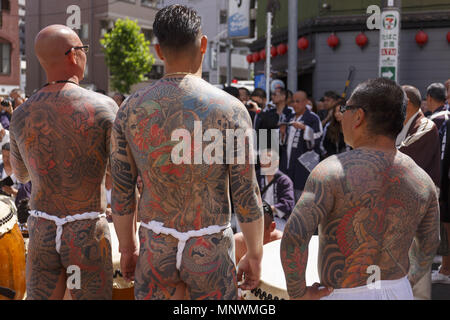 Tokyo, Japan. 20th May 2018. Participants showing their full body tattooed, possibly members of the Japanese mafia or Yakuza, attend the Sanja Matsuri in Asakusa district. The Sanja Matsuri is one of the largest Shinto festivals in Tokyo, and it is held in Tokyo's Asakusa district for three days around the third weekend of May. Credit: ZUMA Press, Inc./Alamy Live News Stock Photo